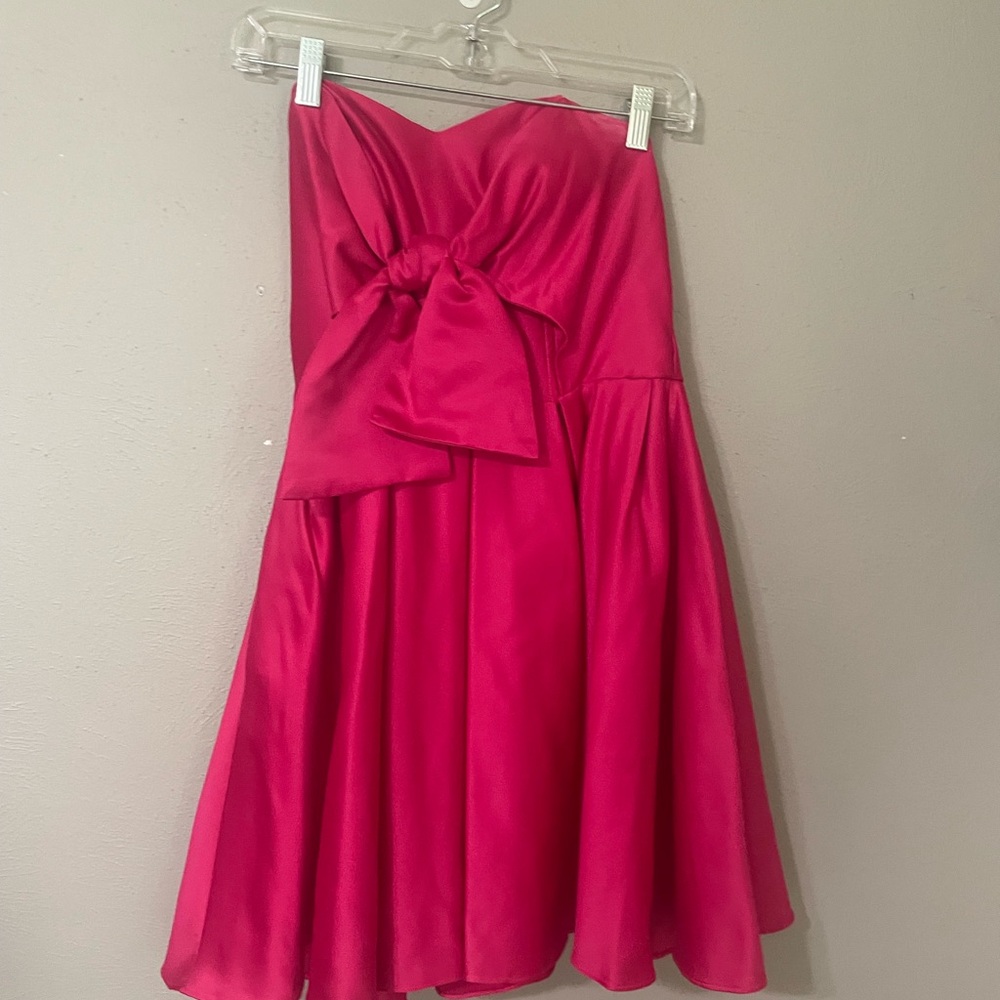 Pink Strapless bow dress.